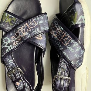 Gently used DKNY sandals in navy blue with print.